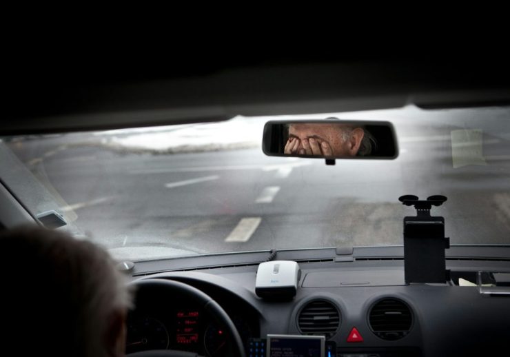 person driving car during daytime
