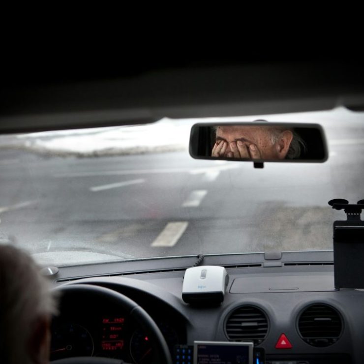 person driving car during daytime