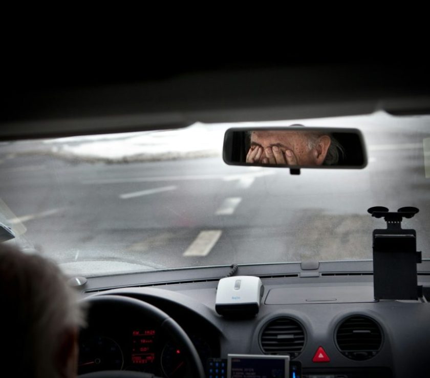 person driving car during daytime